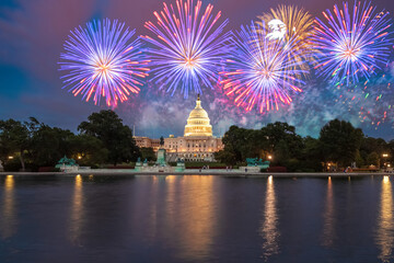 The United States Capitol building in Washington DC at night with fireworks