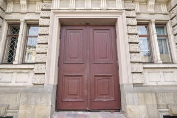 Old vintage wooden facade front brown door