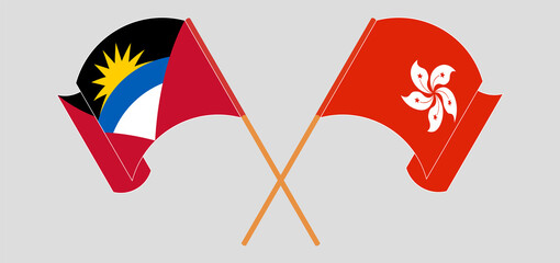 Crossed and waving flags of Antigua and Barbuda and Hong Kong