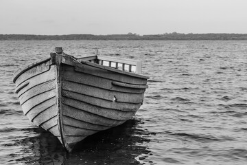 Old boat on the banks of the Tapajós River in the Amazon in black and white - State of Pará,...