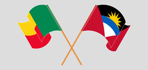 Crossed and waving flags of Antigua and Barbuda and Benin