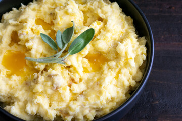 Mashed Potatoes Topped With Butter and Sage Leaves: Mashed Yukon gold potatoes with peels topped...