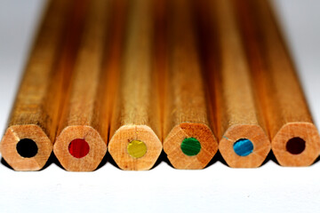Back side of Wooden Crayons on a white background - close up