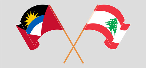 Crossed and waving flags of Antigua and Barbuda and Lebanon