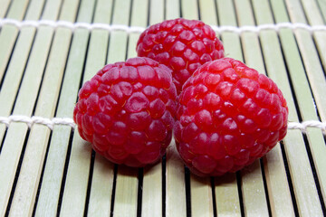 raspberries on wooden background