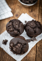 Some Chocolate Muffins (close-up shot; selective focus)