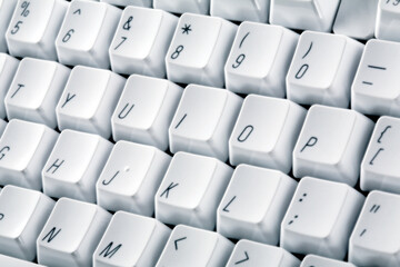 White computer keyboard. Black letters on white buttons. 