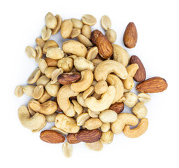 Portion of roasted nuts isolated on white (close up; selective focus)