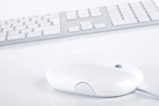  White computer keyboard and mouse. Tidy and minimalistic design.