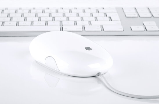  White computer keyboard and mouse. Tidy and minimalistic design.