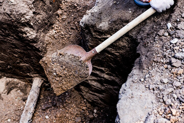 Earthworks. Shovel in the ground in the garden. A bayonet spade in the garden. Digging up the soil...