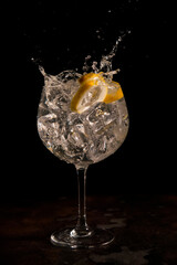 splash of a refreshing gin and tonic from a cocktail bar