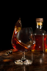 glass of a cognac aged in a wooden barrel