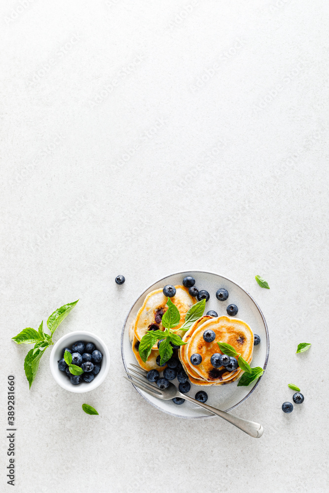 Canvas Prints Blueberry pancakes with fresh berries on breakfast table