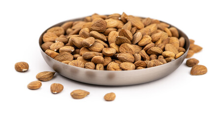 Portion of Apricot Kernels isolated on white (close up shot)