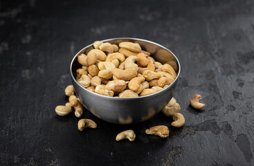 Some roasted Cashew Nuts (close up; selective focus)