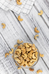 Some roasted Cashew Nuts (close up; selective focus)