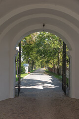 The exit gate from the Sanctuary of Our Lady in Chełm in Poland in the direction of the park