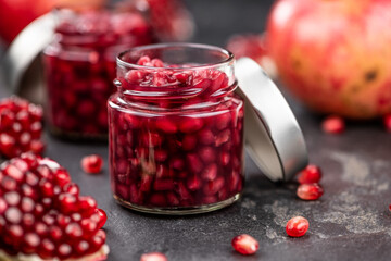 Some healthy preserved Pomegranate seeds (selective focus; close-up shot)