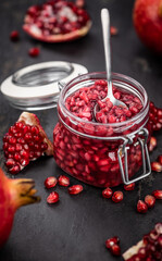 Some healthy preserved Pomegranate seeds (selective focus; close-up shot)