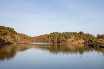 Autumn colors with trees reflecting in a lake
