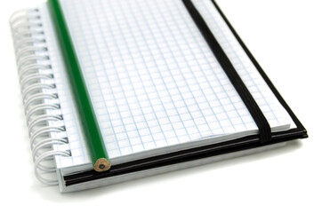 note pad and pencil on a white background