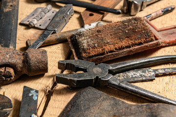 Old vintage household hand tools still life on a wooden background in a DIY and repair concept