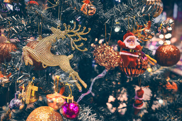 Santa Claus and reindeer baubles at Christmas tree. New year decorations © Philipp Berezhnoy