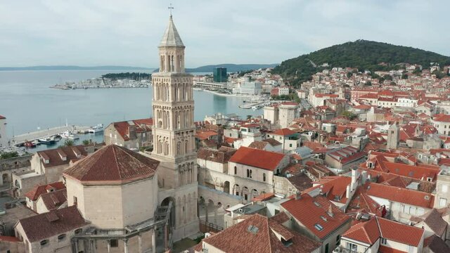flying counter clockwise around iconic bell tower of old town Split Croatia 