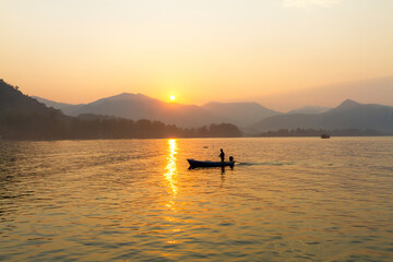 Fototapeta premium Sunrise in the morning and fisherman
