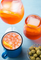 Different glasses of classic italian aperitif aperol spritz cocktail with slice of orange