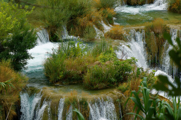 view on natural green plant terraces with waterfalls