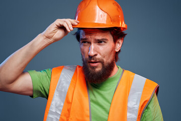 Man in orange construction work cropped view