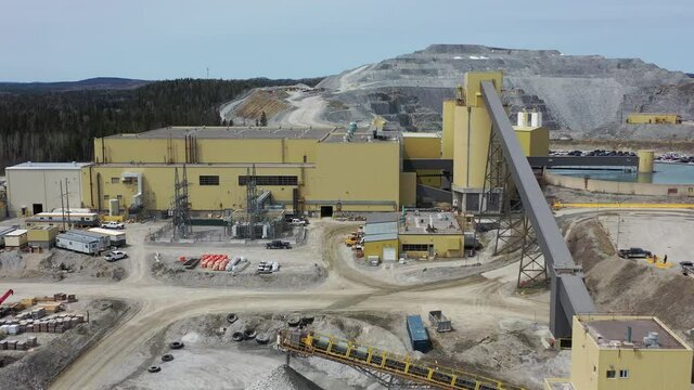 Aerial view of active mine and mining machinery
