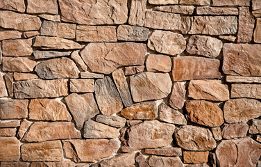The wall is lined with large brown stones