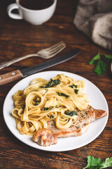 Pork chop steak with tagliatelle and capers