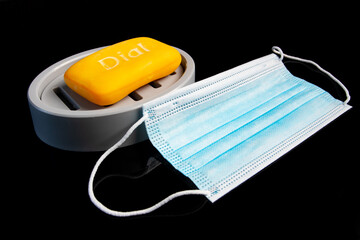 medical mask lying next to soap