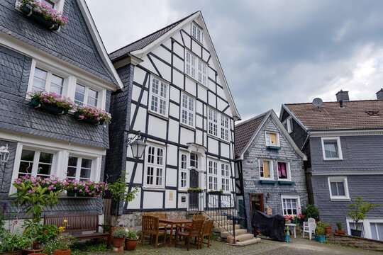 Outdoor street view of small town with traditional German wooden townhouses around Neviges Church in Velbert, Germany.
