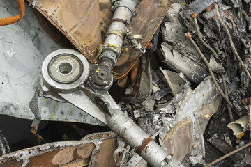 The wreckage of the plane, parts of the steering rods of the burned and broken aircraft at the dump...