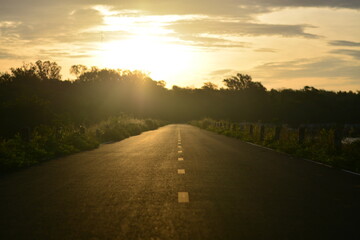 the road line to foward destination with sunlight 