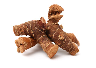 Dried galangal root isolated on white background