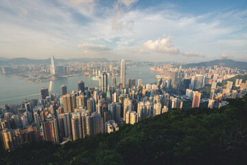 panoramic view of the city during clear summer day with densely packed buildings in urban setting