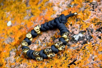 Brutal braided paracord bracelet with multiple skulls unisex
