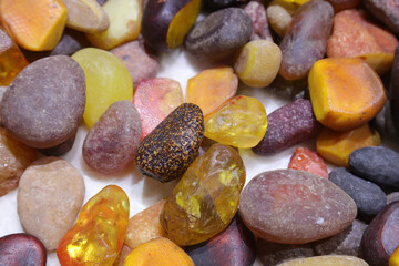 Beeswax stones are stacked together in a handicraft workshop, China