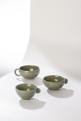 Beautiful pottery mug on white background