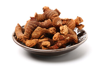 Dried galangal root isolated on white background