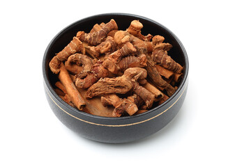 Dried galangal root isolated on white background
