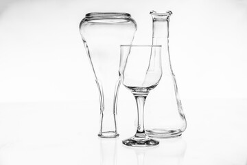 empty wine glass and emtpy bottle on white