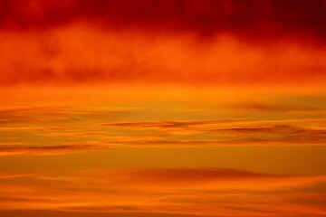 Naklejka na ściany i meble orange red sunset in the sky