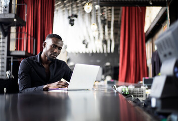 Young Africa American man working at bar.